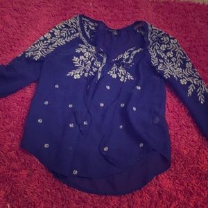 Blue and white short corter lase over top